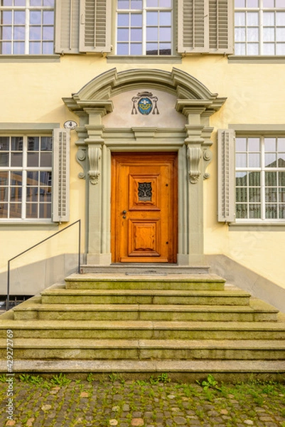 Fototapeta Old wooden doors on solid stone building in Lucerne, Switzerland.