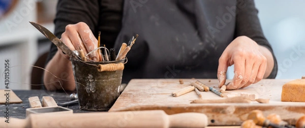 Fototapeta Working process of pottery with tools