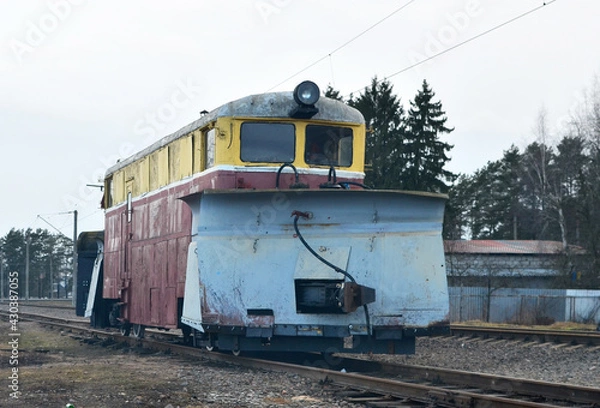 Obraz Train for clearing snow on the railway. Snowplow for railroad. Rail Snow Plow