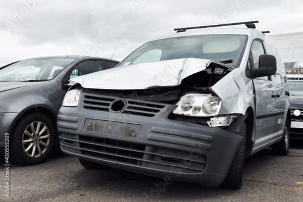 Fototapeta Badly Damaged Van Right Off In Commercial Vehicle Recycling Or Insurance Pound