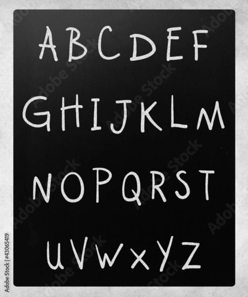 Fototapeta Complete english alphabet handwritten with white chalk on a blac