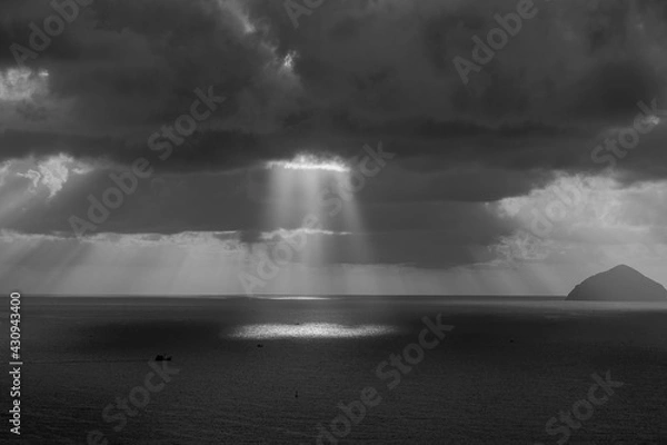 Obraz Landscape sunrise on Hon Chong cape, Nha Trang, Vietnam. Black and white. Morning sky, clouds, sun and sea water at dawn