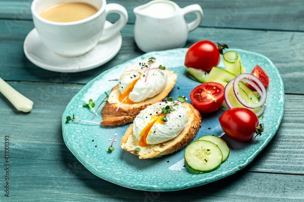 Fototapeta Sandwich with Poached Egg. Bread Toast sliced egg and fresh vegetable salad with cup of coffee for healthy breakfast or snack