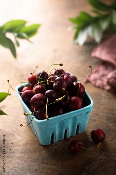 Fototapeta Fresh ripe cherry in a box