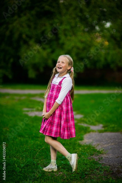 Fototapeta happy girl in purple dress, outdoor walks happy childhood selective focus