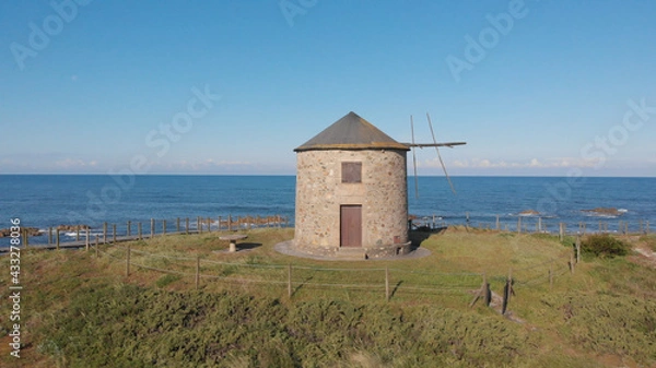 Fototapeta The ancient windmill and "storerooms" in schist of Apulia, Esposende, Portugal.