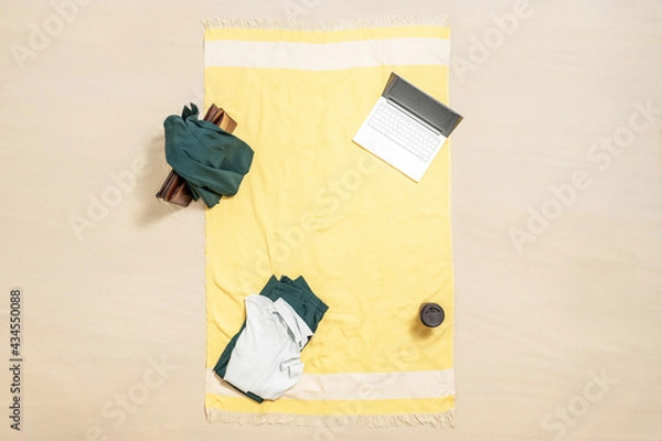 Obraz Woman office suit, office briefcase, laptop and coffee on the beach towel of sand beach. lunch break. Aerial view. Concept