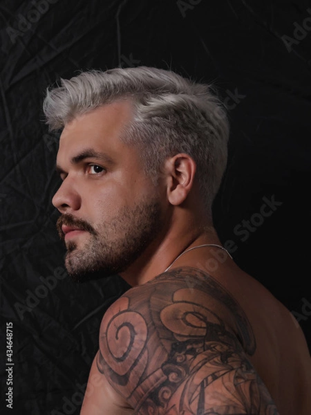 Fototapeta Caucasian Man Platinum Blonde White Hairstyle With Short Haircut and Moustache No Shirt and Sun Tan Gray Hair And Shoulder Tattoo