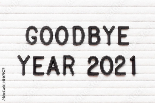 Fototapeta Black color letter in word goodbye year 2021 on white felt board background