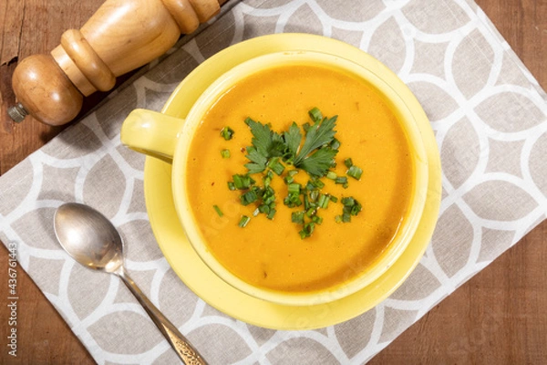 Fototapeta Pumpkin broth on wooden background