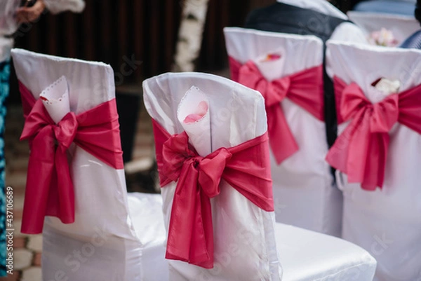 Fototapeta Beautifully decorated and arranged chairs for a festive Banquet. Decor, wedding