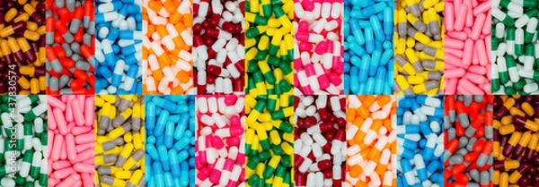 Fototapeta Top view of multi-color capsule pills. Pharmaceutical industry. Many antibiotics, painkillers, supplements capsule pills. Capsule pill production. Pharmacy banner. Drug selection. Pharmacy products.