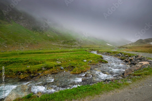 Fototapeta alpin river and misty mountains (Vorarlberg, Austria)