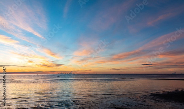 Fototapeta Silhouette at the hun hin beach of thailand on early morning in summer, Beautiful sunset over the sea.