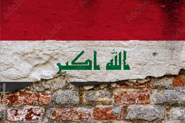 Fototapeta Graphic Concept with a Flag of Iraq painted on a damaged brick wall.