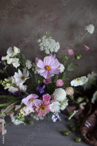 Fototapeta Floral arrangement of summer garden flowers in pastel shades on the table. English floristry. Still life.