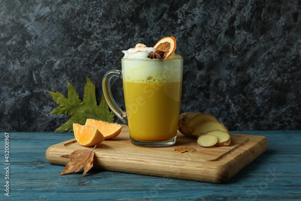 Fototapeta Concept of pumpkin latte on rustic wooden table