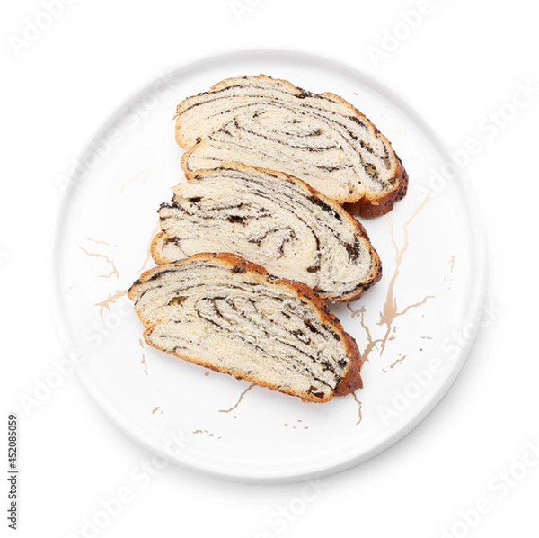 Fototapeta Plate with slices of tasty poppy seed bun on white background