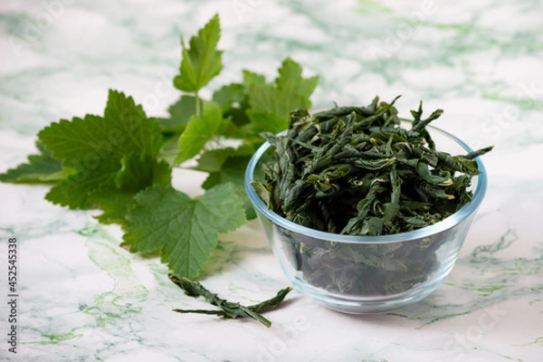 Obraz Fermentation of currant leaves for herbal tea