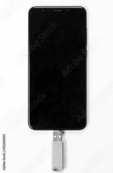 Fototapeta Portable USB flash drive connected to mobile phone isolated on white background. Mockup. High quality photo