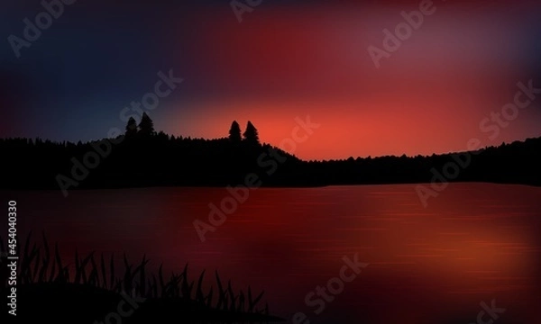 Fototapeta Beautiful dark sunset over the water with distant land and silhouette hills covered by trees. Reflections on the water surface.