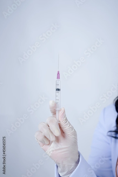 Fototapeta COVID-19 vaccination device or doctor's syringe Guidelines for preventing the virus with vaccinations and preventive medicines