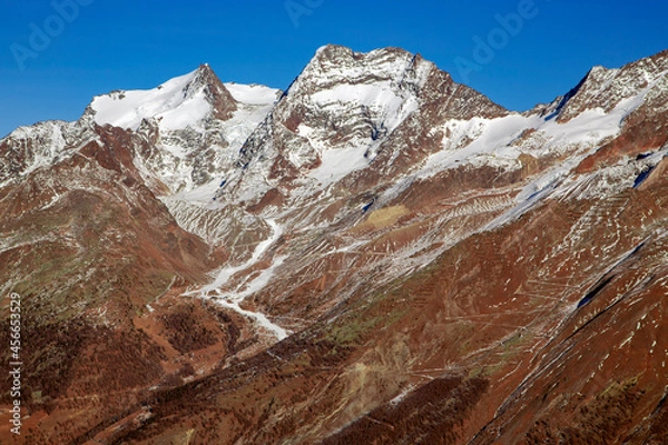 Fototapeta The magnificent Allalinhorn 4027m part of the Mischabel group of mountains in the Saas Fee Valley in southern Switzerland.