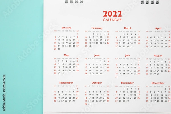 Fototapeta 2022 calendar page on blue background business planning appointment meeting concept