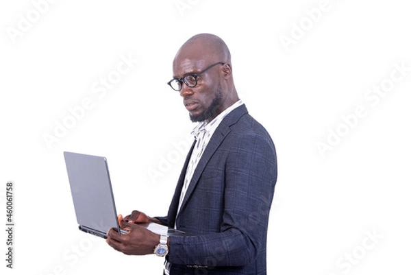 Fototapeta close-up of a young businessman holding laptop, pensive.