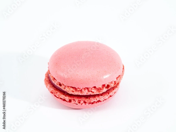 Fototapeta Sweet raspberries macarons isolated on white background.