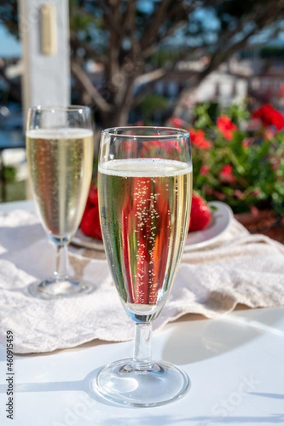 Fototapeta Summer party, pouring of French champagne sparkling wine in glasses in yacht harbour of Port Grimaud near Saint-Tropez, French Riviera vacation, France