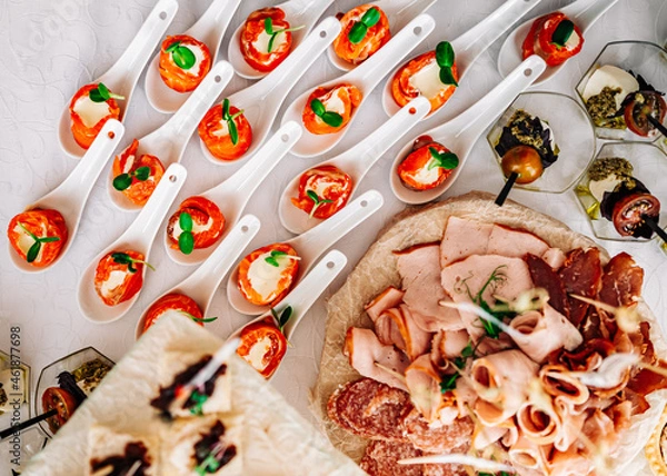 Fototapeta food buffer catering. Different canapes and appetizer on table