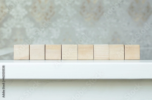 Obraz Eight blank wooden block cubes on a white background for your text. free space for business concept template and banner.