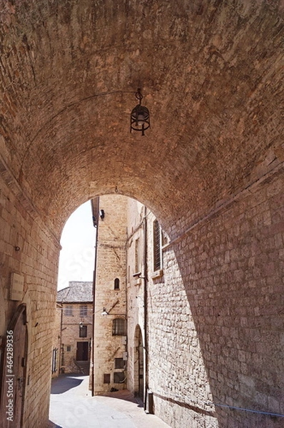 Fototapeta Typical alley with staircase in the medieval old town of Assisi, Italy