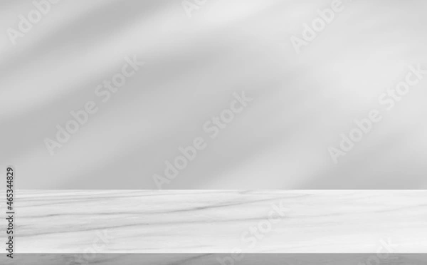 Fototapeta Marble floor shelf stage and blurred shadow leaves tree on wall background well editing display product and text advertising on free space backdrop