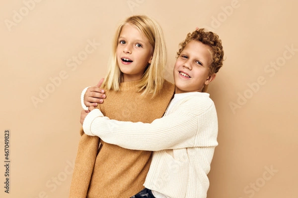 Fototapeta happy children in sweaters isolated background