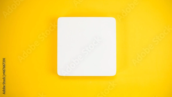 Fototapeta blank white product podium on yellow background