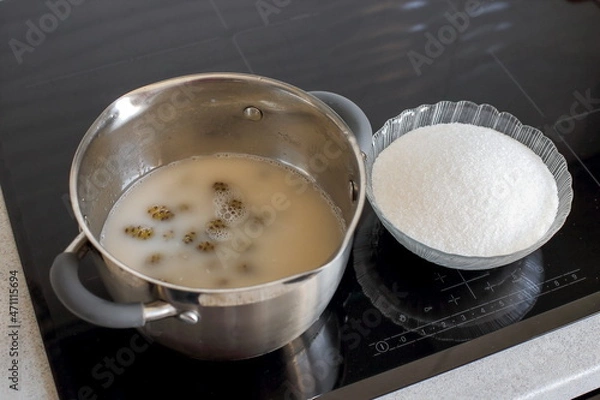 Fototapeta Step-by-step instructions for jam from pine cones. Step 3: boiled cones in a saucepan, add sugar, cook until tender