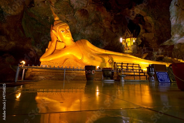 Fototapeta Lying gold Buddha in the temple of Thailand