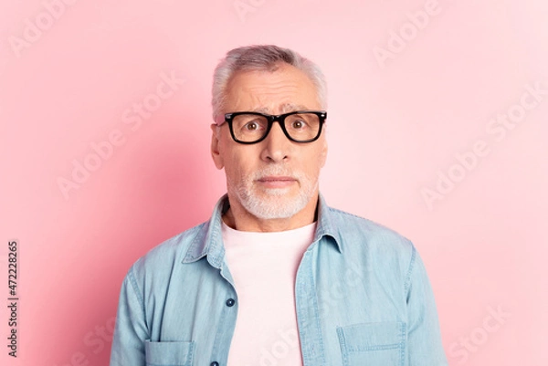 Fototapeta Photo of mature man unhappy upset anxiou worried fail mistake wear eyeglasses isolated over pink color background