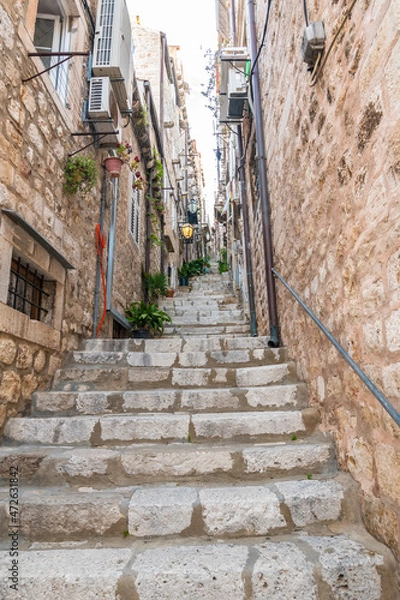 Fototapeta Narrow street with stairs at old city of Dubrovnik, Croatia.