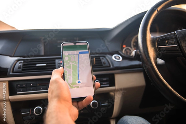 Obraz driver holding smart phone with navigation