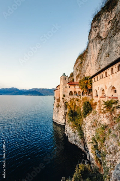 Fototapeta Hermitage of Santa Caterina del Sasso on Lake Maggiore at sunset