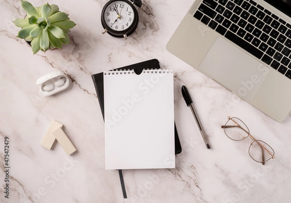 Fototapeta Top view desktop blank calendar, notebook and laptop on light gray marble background