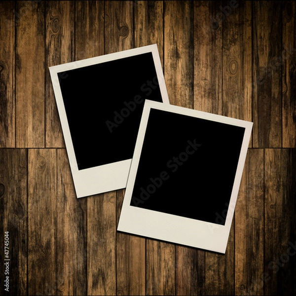 Fototapeta Blank instant photo frames on old wooden background