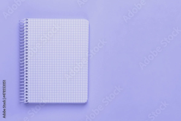 Fototapeta Trendy very peri color of the year 2022, violet blue, lavender open spiral notebook with blank empty sheets with copy space