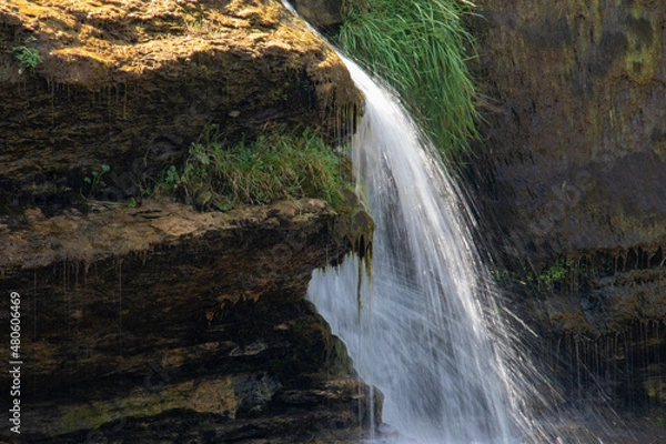 Fototapeta Swimming in the waterfall in the mountains