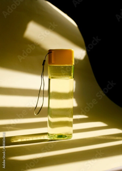 Fototapeta close up reusable plastic water bottle, reusable yellow water bottle