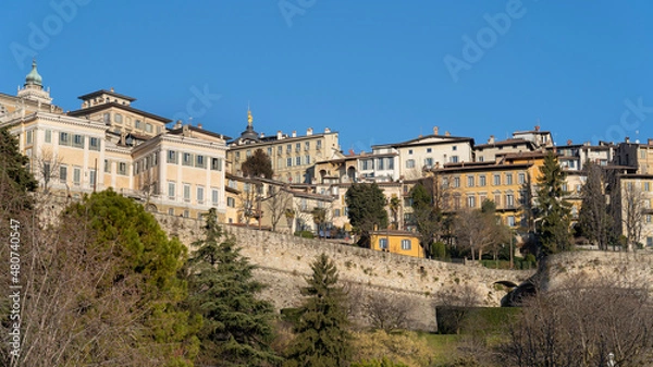 Fototapeta Bergamo, Italy. Amazing landscape at the old town located on the top of the hill. View from the new city (downtown). Bergamo one of the most beautiful city in Italy. Touristic destination