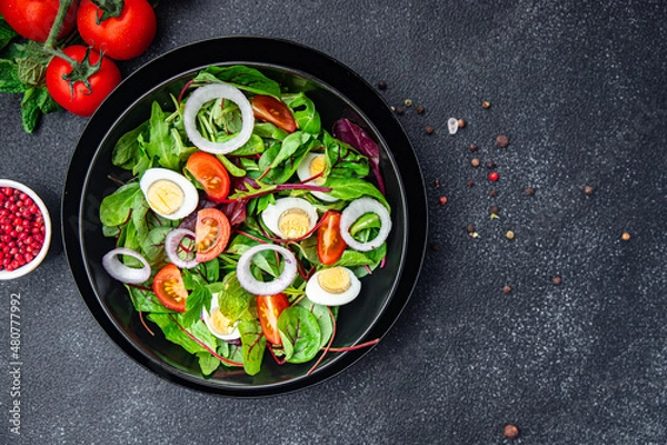 Fototapeta salad quail egg tomato, lettuce mix leaves healthy meal food snack on the table copy space food background rustic top view keto or paleo diet veggie vegetarian food no meat